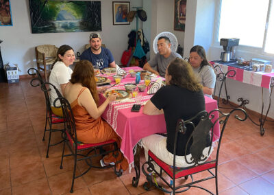 Guests enjoy the conversation at the breakfast table at zandoyo bed & breakfast