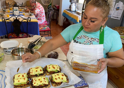 Assistant cook Edna Loaeza prepares molletes at Zandoyo Bed & Breakfast