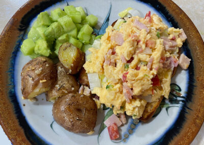 Scrambled eggs with creamed leeks and ham at zandoyo bed & breakfast