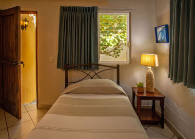 the bed in the tiny room at zandoyo