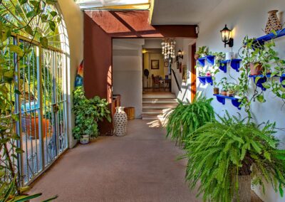 passage way between dining room, guest rooms and pool