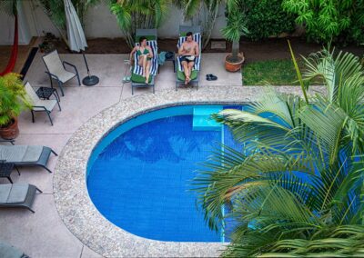 guests enjoy relaxing poolside